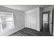 Bedroom with double door closet and gray flooring at 507 Cassia Dr, Davenport, FL 33897