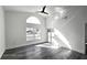 Spacious bedroom with grey flooring and pool access at 507 Cassia Dr, Davenport, FL 33897