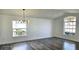 Bright dining room with hardwood floors and stylish chandelier at 507 Cassia Dr, Davenport, FL 33897