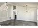 Spacious dining area with hardwood floors and two chandeliers at 507 Cassia Dr, Davenport, FL 33897