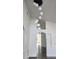 Bright entryway with a modern light fixture and high ceilings at 507 Cassia Dr, Davenport, FL 33897
