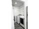Bright laundry room with washer, dryer, and ample shelving at 507 Cassia Dr, Davenport, FL 33897