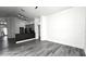 Living room with grey flooring and kitchen access at 507 Cassia Dr, Davenport, FL 33897