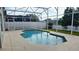 Inviting screened-in pool with a large backyard at 507 Cassia Dr, Davenport, FL 33897
