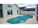 Inviting pool area with screened enclosure at 507 Cassia Dr, Davenport, FL 33897