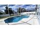 Relaxing screened-in pool with patio furniture at 507 Cassia Dr, Davenport, FL 33897