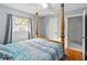 Bright bedroom with a post bed and window at 508 Bar Dr, Kissimmee, FL 34759