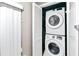 Small laundry closet with stackable washer and dryer at 508 Bar Dr, Kissimmee, FL 34759