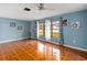 Living room featuring tile floors and large windows at 508 Bar Dr, Kissimmee, FL 34759