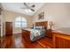 Main bedroom with hardwood floors and wood furniture at 5323 Mill Stream Dr, St Cloud, FL 34771