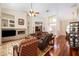 Living room with hardwood floors, fireplace, and ample natural light at 5323 Mill Stream Dr, St Cloud, FL 34771