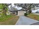 Cute one-story home with attached garage and landscaped yard at 56 Buck Cir, Haines City, FL 33844