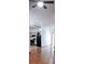 Living room with wood flooring and view into kitchen at 56 Buck Cir, Haines City, FL 33844