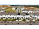 Aerial view of townhouses with solar panels and green space at 592 Madison Dr, Davenport, FL 33837