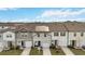 Aerial view of townhouses with solar panels at 592 Madison Dr, Davenport, FL 33837