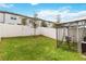 Fenced backyard with gazebo and grassy area at 592 Madison Dr, Davenport, FL 33837