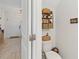 Clean and well-appointed half bathroom with floating shelves and modern decor at 592 Madison Dr, Davenport, FL 33837