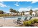 Inviting community pool with lounge chairs and surrounding homes at 592 Madison Dr, Davenport, FL 33837