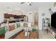 Open concept kitchen and living area with modern appliances and ample seating at 592 Madison Dr, Davenport, FL 33837