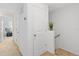 Upstairs hallway with access to bedrooms and stairs at 592 Madison Dr, Davenport, FL 33837