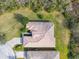 Aerial view of house showing roofline and landscaping at 601 Carmel Ln, Kissimmee, FL 34759