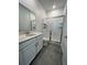 Bathroom boasts a walk-in shower and vanity at 6308 Chirpine Ln, St Cloud, FL 34771