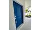 Bright blue front door welcomes guests at 6308 Chirpine Ln, St Cloud, FL 34771