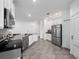 Bright kitchen with stainless steel appliances and white cabinets at 6308 Chirpine Ln, St Cloud, FL 34771