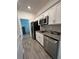 Small kitchen with stainless steel appliances at 6308 Chirpine Ln, St Cloud, FL 34771