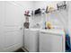 Laundry room with washer, dryer, and shelving at 6308 Chirpine Ln, St Cloud, FL 34771