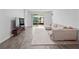Spacious living room featuring neutral tones and ample natural light at 6308 Chirpine Ln, St Cloud, FL 34771