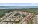 Beautiful aerial view of a residential community with a lake view and mature landscaping at 760 Lake Marion Golf Resort, Poinciana, FL 34759