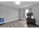 Bright bedroom features wood-look floors, and neutral wall color at 760 Lake Marion Golf Resort, Poinciana, FL 34759