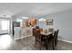Dining room with wood floors, table and chairs, and breakfast bar looking into the kitchen at 760 Lake Marion Golf Resort, Poinciana, FL 34759