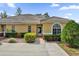 Inviting exterior of a single-story home with a well-manicured lawn at 760 Lake Marion Golf Resort, Poinciana, FL 34759