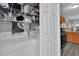 Stackable washer and dryer in convenient laundry room with storage shelves at 760 Lake Marion Golf Resort, Poinciana, FL 34759