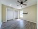 Bedroom with grey laminate flooring and a large closet at 8079 Cloverglen Cir, Orlando, FL 32818