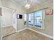 Bright breakfast nook with large windows and a view of the backyard at 8079 Cloverglen Cir, Orlando, FL 32818