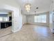 Open dining room with tile floors and chandelier at 8079 Cloverglen Cir, Orlando, FL 32818