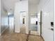 Bright entryway with tile floors and mirrored closet at 8079 Cloverglen Cir, Orlando, FL 32818