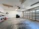Spacious two-car garage with built-in shelving and ample storage space at 8079 Cloverglen Cir, Orlando, FL 32818