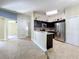 Modern kitchen with stainless steel appliances and granite countertops at 8079 Cloverglen Cir, Orlando, FL 32818