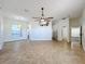 Spacious living room with tile floors and ceiling fan at 8079 Cloverglen Cir, Orlando, FL 32818