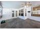 Bright screened porch with ceiling fan, ideal for relaxing at 8079 Cloverglen Cir, Orlando, FL 32818