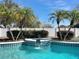 Inviting swimming pool with a spa and lush landscaping at 8079 Cloverglen Cir, Orlando, FL 32818