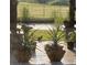 Relaxing patio with potted plants and pond view at 825 E Lakeshore Blvd, Kissimmee, FL 34744
