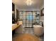 Modern bathroom with black framed glass shower and patterned tile floor at 825 E Lakeshore Blvd, Kissimmee, FL 34744