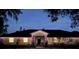 Charming single-story home with a well-manicured lawn at night at 825 E Lakeshore Blvd, Kissimmee, FL 34744