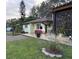 Charming yellow house with patio and landscaping at 825 E Lakeshore Blvd, Kissimmee, FL 34744