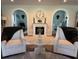 Elegant living area with a fireplace and comfortable seating at 825 E Lakeshore Blvd, Kissimmee, FL 34744